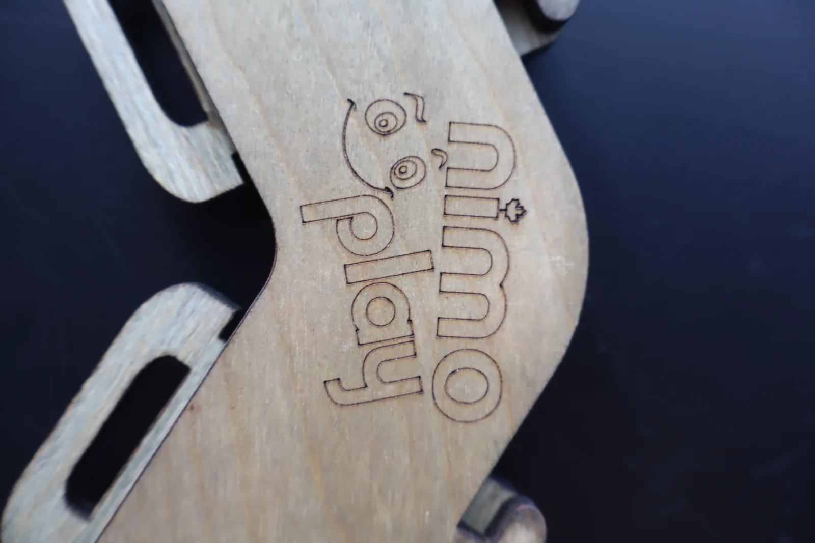 Close-up of a wooden NimoPlay connector with its locking tabs