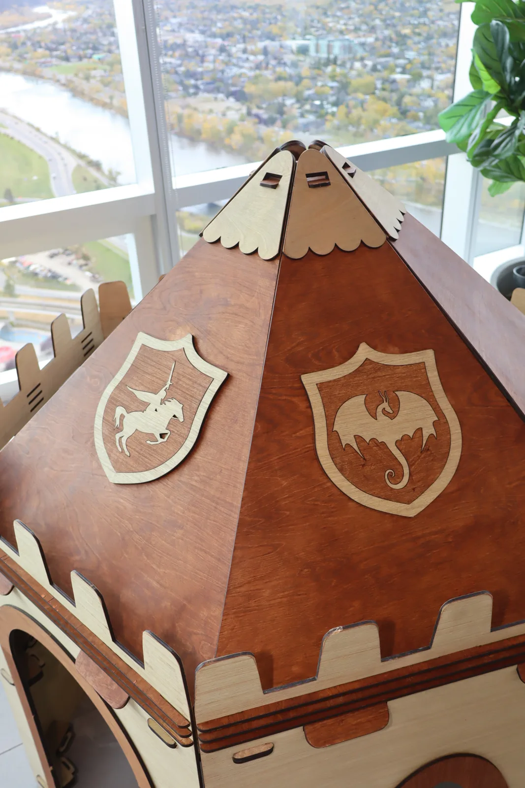 Close-up of the shield on a brown NimoPlay castle roof